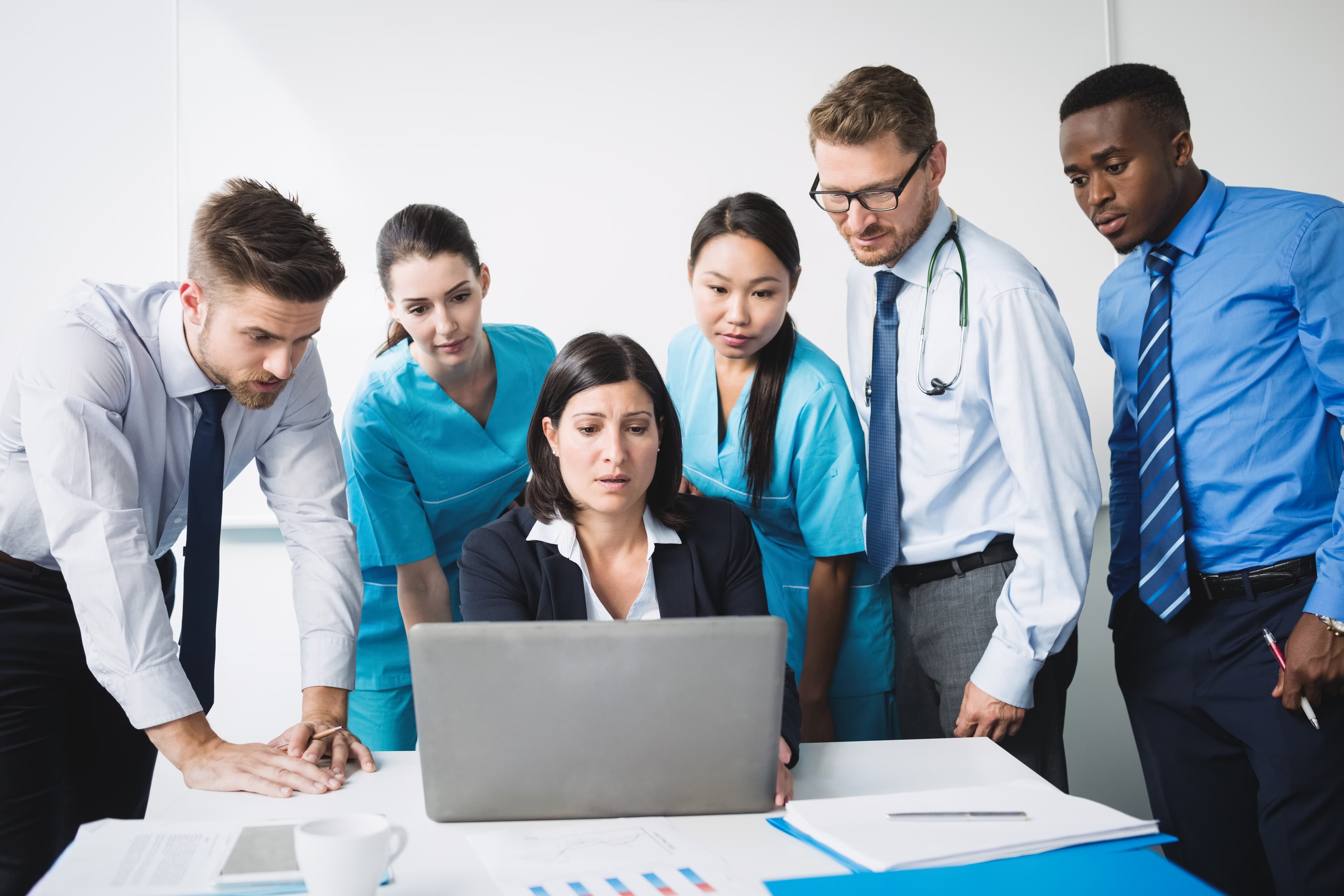 Healthcare professionals helping patients